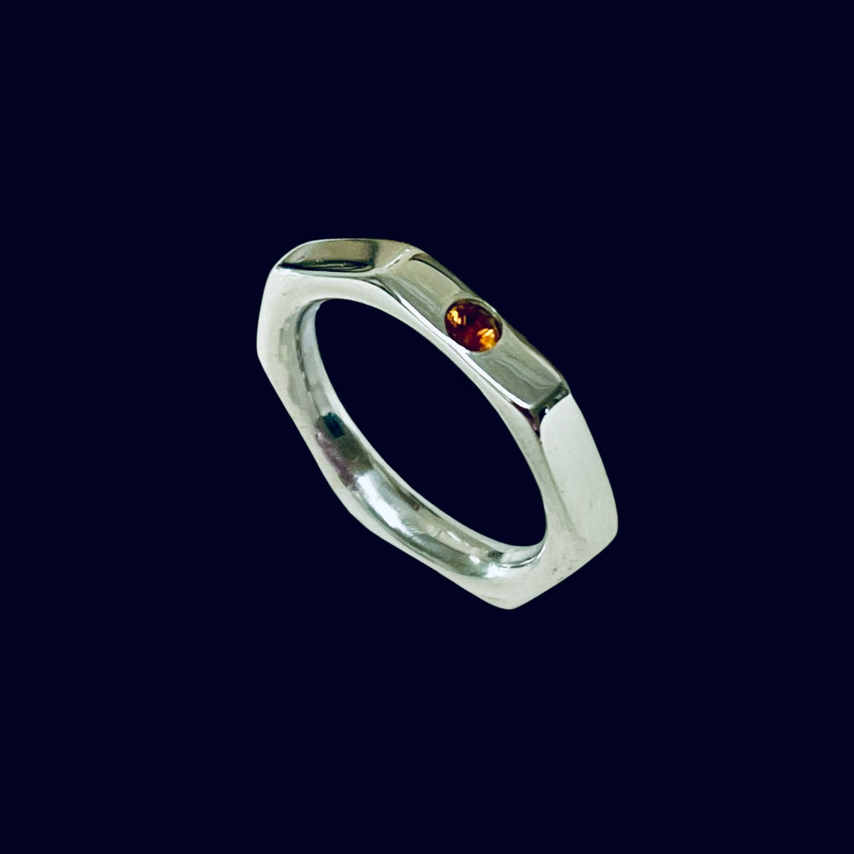 The Heptagon with flush set gem stone